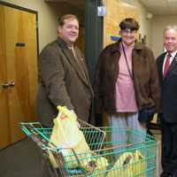 <p>Local dignitaries pitched in at the Rockland Independent Living Center to distribute turkey dinners.</p>