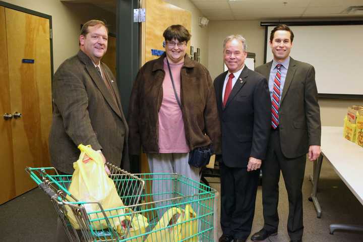 Local dignitaries pitched in at the Rockland Independent Living Center to distribute turkey dinners.