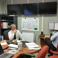 <p>Rockland County Executive Ed Day, center, takes part in an Indian Point disaster drill at the Fire Training Center in Pomona.</p>