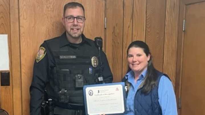 Officer Justin Schlottman, the most recent hire at the Robeson Twp. Police Department, was rewarded for rendering first-aid to a badly bleeding dog bite victim.