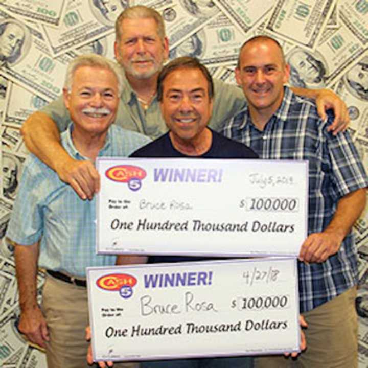 Bruce Rosa (center) of Stamford is joined by friends (L-R) Bob Faillaci, Peter diSpagna and son-in-law Michael Lupinacci at CT Lottery Headquarters.