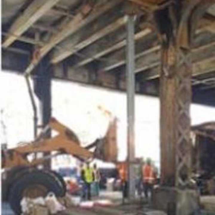 Metro-North crews work Wednesday to repair damage to the Viaduct after a fire Tuesday.