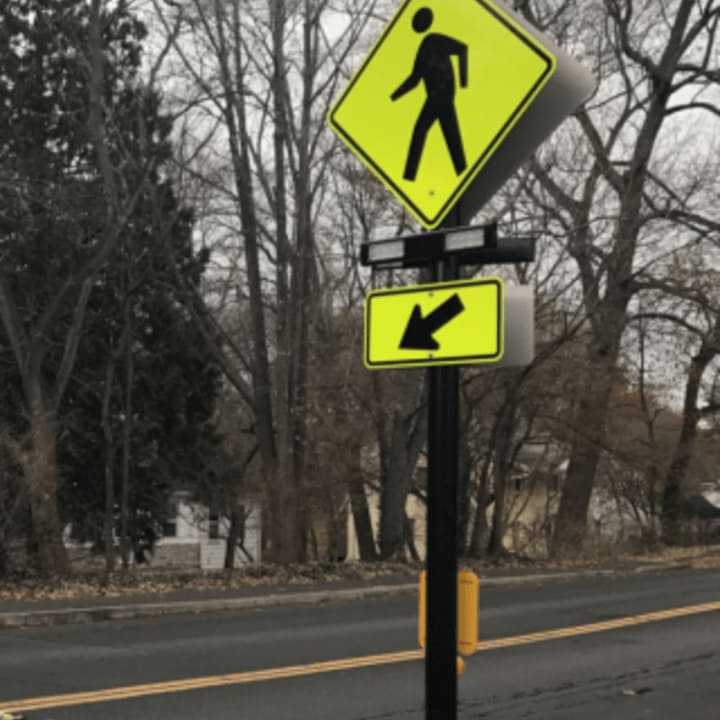 Stamford has installed four of these high-tech pedestrian crossing signals,  known as Rectangular Rapid Flashing Beacon (RRFB). See story for the locations.