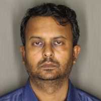 Scammer Caught Red-Handed With $36K Taken From Woman From Region, Police Say