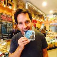 <p>Actor and Co-Owner Paul Rudd wraps his teeth around a &quot;Captain America - Civil War&quot; cookie.</p>