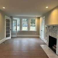 <p>The Sharon home has a spacious living room with a fireplace.</p>