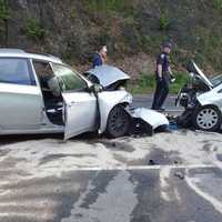 <p>First responders investigate the crash scene at Rive Road and Mt. Pleasant Road in Shelton on Wednesday.</p>