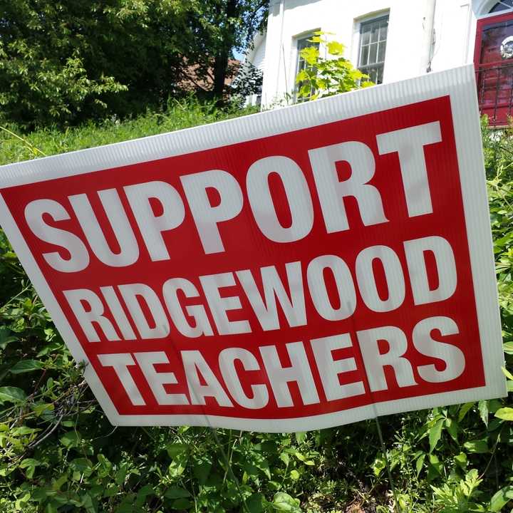 Signs in support of Ridgewood teachers have remained in place all over the village for months.