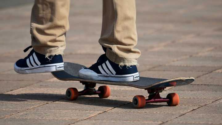 A skateboard and skateboarder