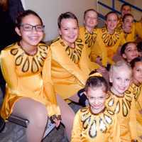 <p>Sprites from the Southern Connecticut Synchronized Skating Club watch the competition from the stands at Terry Conners Rink.</p>