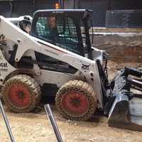 <p>A skid loader.</p>