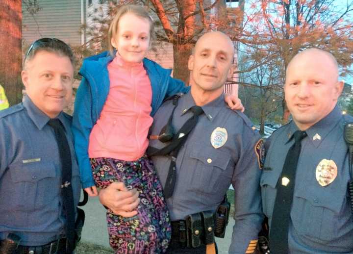 Sofya with Mahwah Police Officer Tom Solimano, Lt. Jeffrey Dino, Sgt. Brendan Mullin