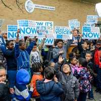 <p>Students at the Martin Luther King Jr. Academy hold signs Wednesday supporting legislation that would approve the first phase of a schools rebuilding project.</p>