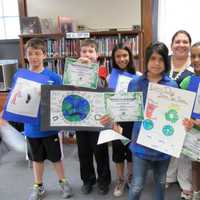 <p>Kids honor the planet at a past Earth Day celebration in Ossining.</p>