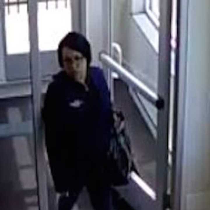 Surveillance footage of the woman accused of robbing the First County Bank on Connecticut Avenue in Norwalk.