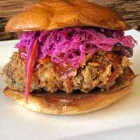 <p>The Crispy Mother Clucker: buttermilk fried chicken breast, pickled slaw, and Korean bbq sauce on a toasted bun.</p>