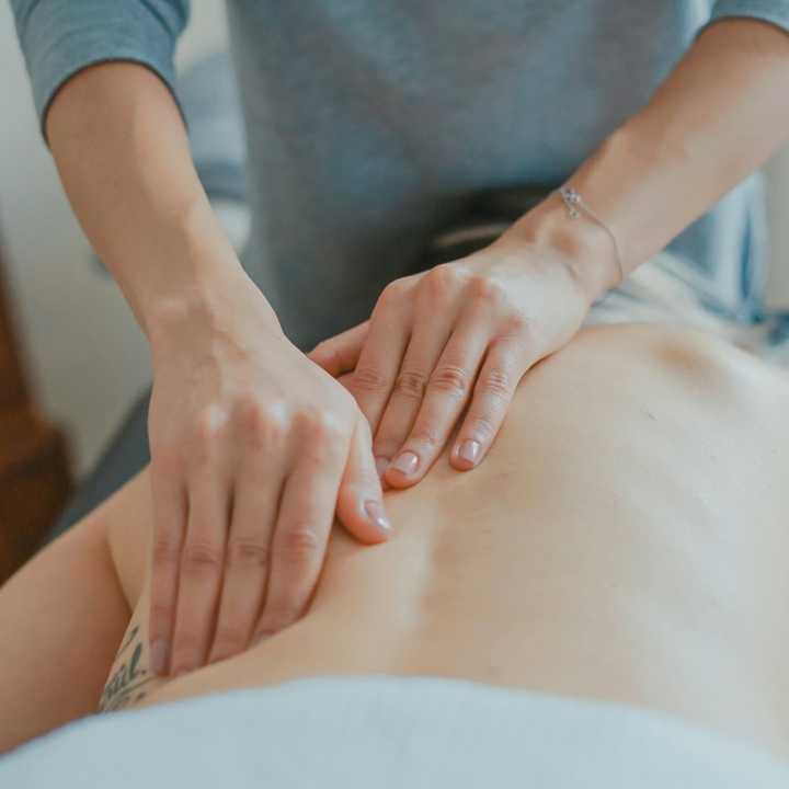 A chiropractor works on a patient.&nbsp;