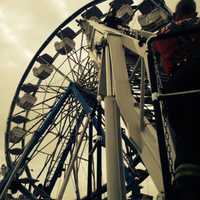 <p>Stratford firefighters practice making a rescue from a Ferris wheel in May 2014. That training came in handy Wednesday night when the Ferris wheel stalled at the same carnival.</p>