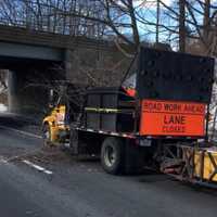 <p>High winds sent a tree branch crashing down on contractors workers on I-95 in Greenwich on Monday.</p>