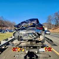 <p>The damage to the trooper's car.&nbsp;</p>