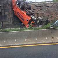 <p>The truck went through a fence and off the overpass (top left).</p>