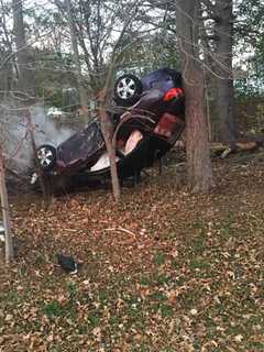 Car Flips Over, Engine Catches Fire After Trumbull Crash