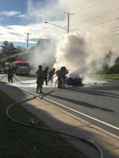 Firefighters Douse Burning Car In Trumbull During Rush Hour