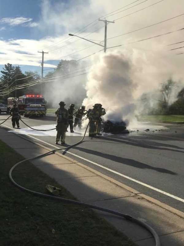 Firefighters Douse Burning Car In Trumbull During Rush Hour
