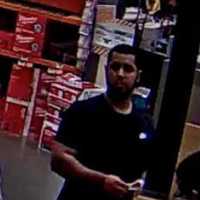 <p>Surveillance footage of one of the suspects believed to have stolen credit cards from Trumbull mailboxes</p>