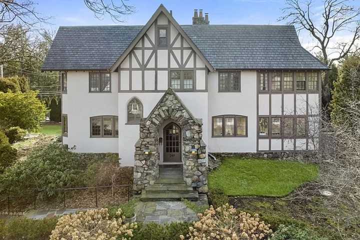 $3.25M Tudor-Style House In Newton Features Two-Tiered Deck With Built-In Gas Grill