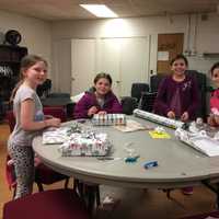 <p>Together members of the Village Lutheran Church Youth Group wrapped the toys, games, books and other gifts, which will help brighten another child&#x27;s Christmas morning.</p>