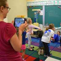 <p>Bronxville Elementary first-grade students act out an Australian folktale while their teacher films them, as part of training on iMovie through the Jacob Burns Film Center.</p>