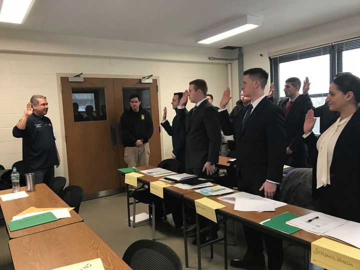 Yonkers Mayor Mike Spano swearing in the new hires.