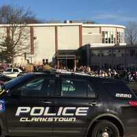 <p>Residents and police wait outside of the Tappan Zee Nursing Home in Nyack as officers search the complex for a reported suspicious device.</p>