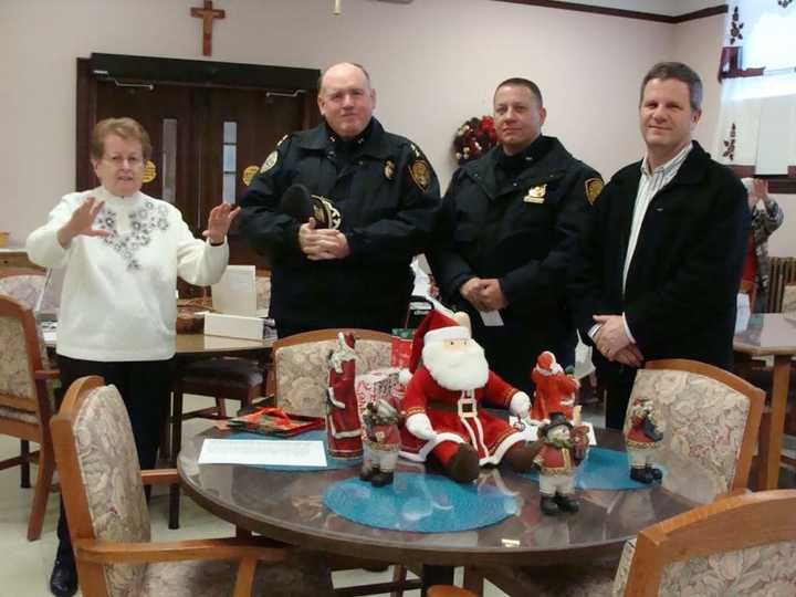 Blauvelt Dominican Sister Loretta Lynch and members of the Orangetown Police Department.