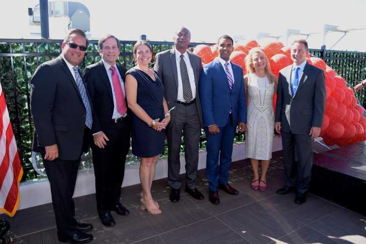 Elected officials and developers celebrating the opening of The Modern in Mount Vernon.