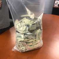 <p>Hundreds of thousands of dollars were seized during a drug bust in Pleasantville.</p>