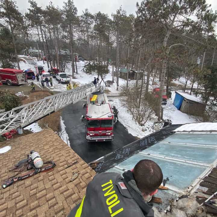 Fire crews in Dutchess County worked to contain a house fire to an attic in Red Hook.