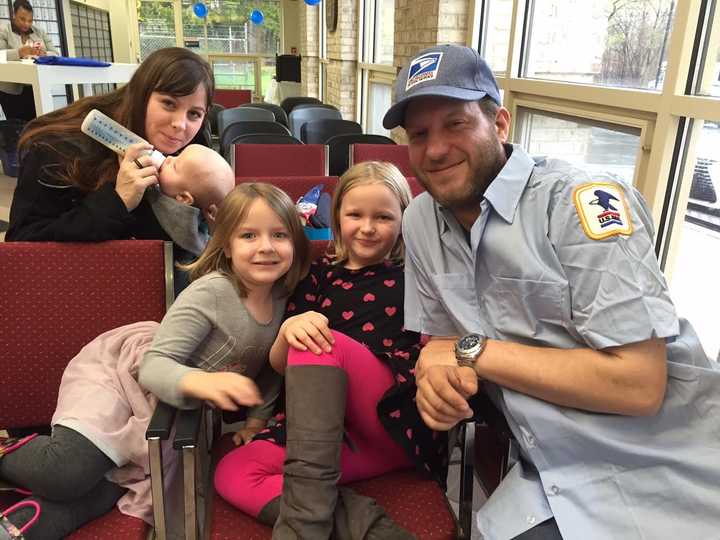 (L-R) Wife Sarah with son Parker, daughters Violet and Lilah joined senior postal officials, municipal leaders, union representatives, and New City postal coworkers to recognize City Carrier Assistant Robert Korba Jr. for his life-saving actions.