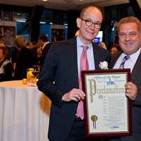 <p>Yonkers Partners in Education honoree Jeffrey Gittleman, left, of Chappaqua, and Yonkers Mayor Mike Spano.</p>