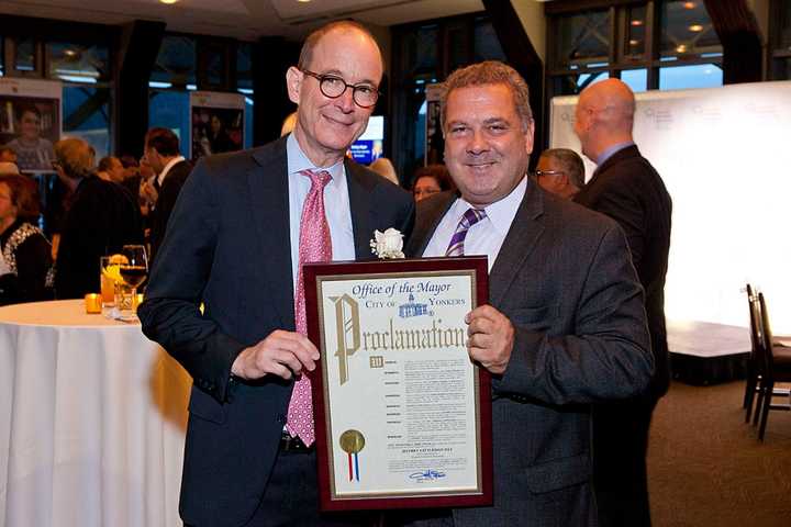 Yonkers Partners in Education honoree Jeffrey Gittleman, left, of Chappaqua, and Yonkers Mayor Mike Spano.