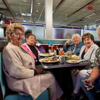 <p>Guy Fieri visiting with customers.</p>