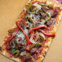 <p>Spicy Italian Sausage and Peppers Pizza</p>