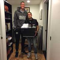 <p>Christian Alexander with Mason Plumlee</p>