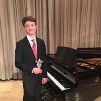 <p>Luca Gierlinger of New Rochelle with his Rondo Vanguard Trophy.</p>