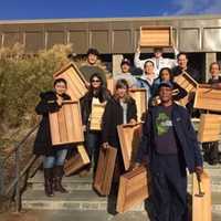 <p>On Saturday, November 14th 2015: A team of volunteers hold finished planter boxes that they built for a greenhouse in Harrison, where they will be used to grow fresh winter produce for those in need.</p>