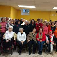 <p>Garth Road Seniors welcoming Father Terry Tull to the Center in Eastchester.</p>