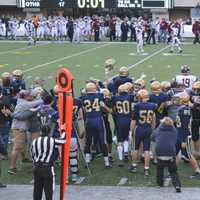 <p>The Old Tappan football team heads to midfield after winning the state title over Wayne Hills Saturday, Dec. 5.</p>