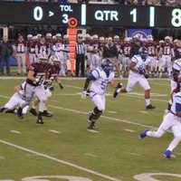 <p>Passaic Tech moves the ball against Ridgewood&#x27;s defense in the state football championship game Saturday, Dec. 5 at MetLife Stadium. </p>