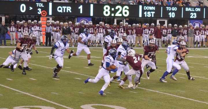 Passaic Tech moves the ball against Ridgewood&#x27;s defense in the state football championship game Saturday, Dec. 5 at MetLife Stadium. 